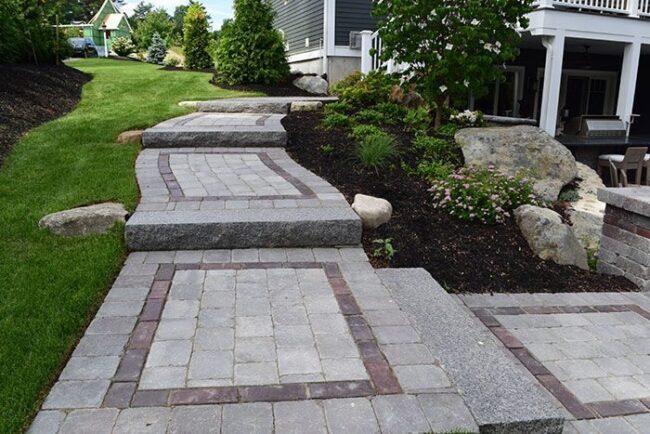 Paved walkways in a residential yard in Pelham, NH