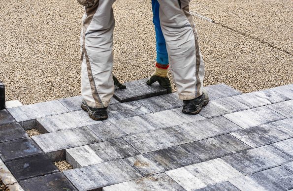 Beautiful stone walkway being installed by a paver in Pelham, NH
